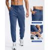 imageMens Cotton Fleece Lined Joggers with Zipper Pockets Athletic Workout Gym Lounge Sweatpants Winter Warm PantsPeacock Blue