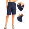 imageWomens 10 Hiking Golf Long Shorts with 5 Pockets Knee Length Lightweight Quick Dry Cargo Bermuda Shorts for WomenNavy